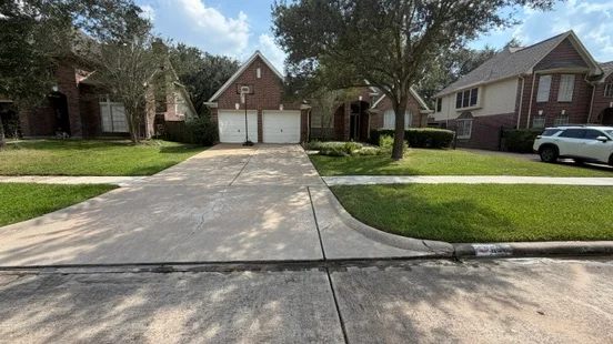 The driveway after cleaning, looking toward the house and front lawn