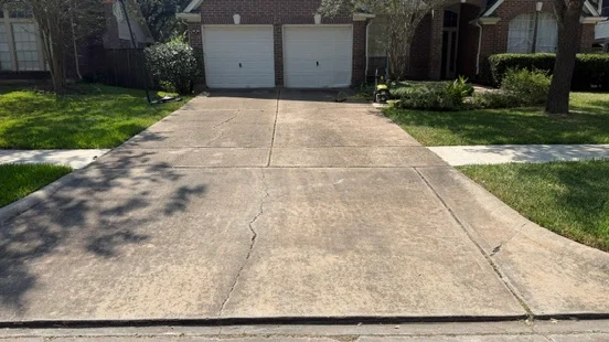 Driveway before cleaning with visible dark buildup